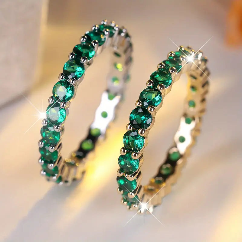 Emerald Eternity Ring with Prong-Set Round Stones in Gold Tone