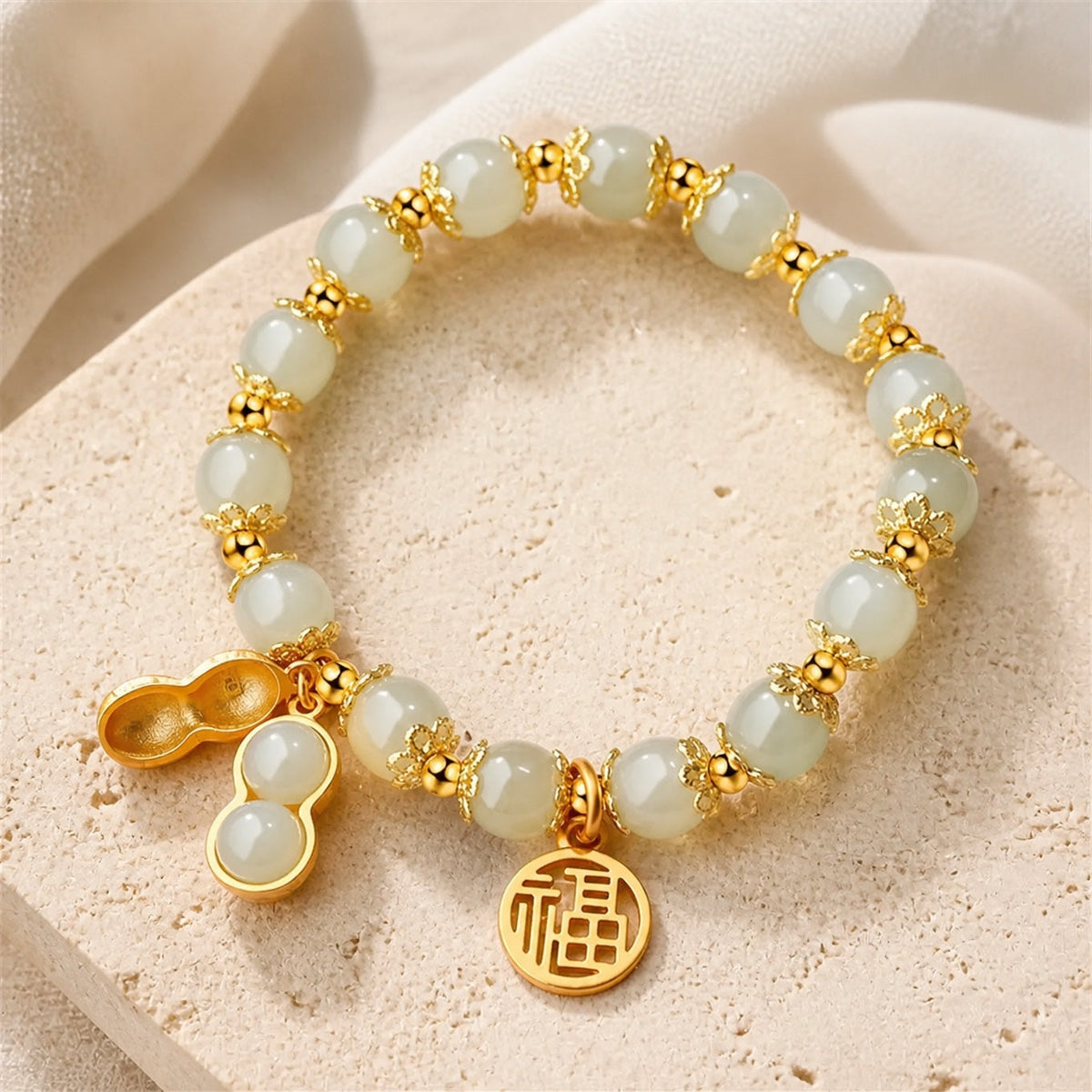 Jade-Tone and Red Agate-Tone Beaded Bracelet with Gold Charms — main image