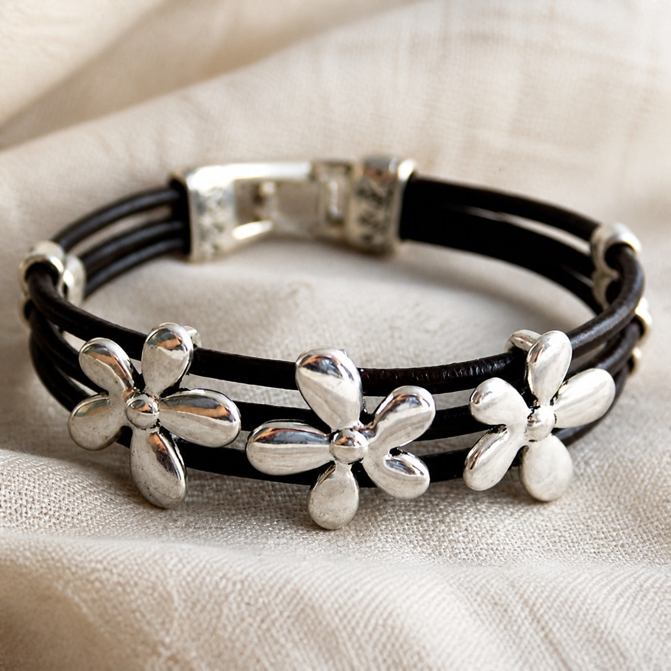 Black Leather Multi-Strand Bracelet with Silver Flower Charms