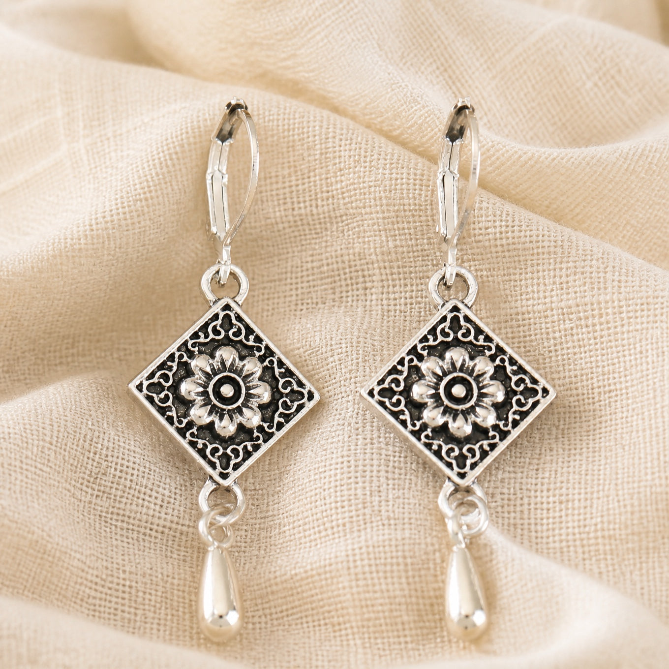 Sunflower Embossed Drop Earrings with Antique Silver Scrollwork Border