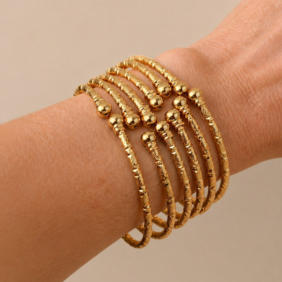 Hammered Gold Bangle Bracelet with Bead End Details — main image