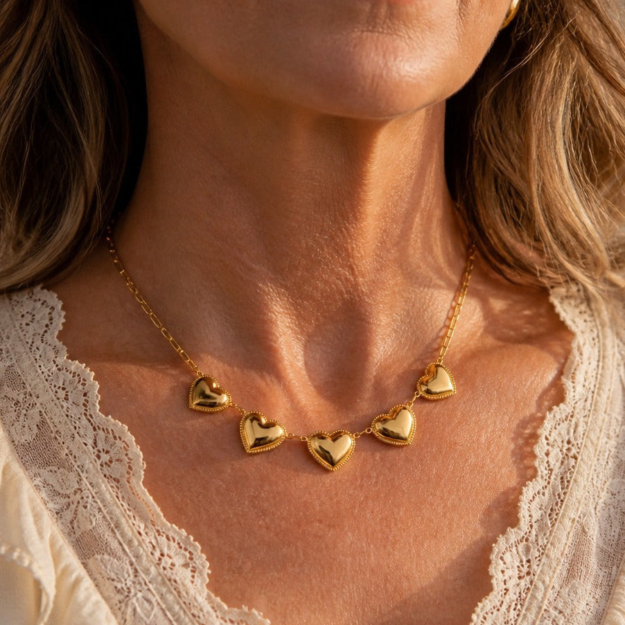 Graduated Heart Cascade Necklace with Textured Gold-Tone Pendants — main image