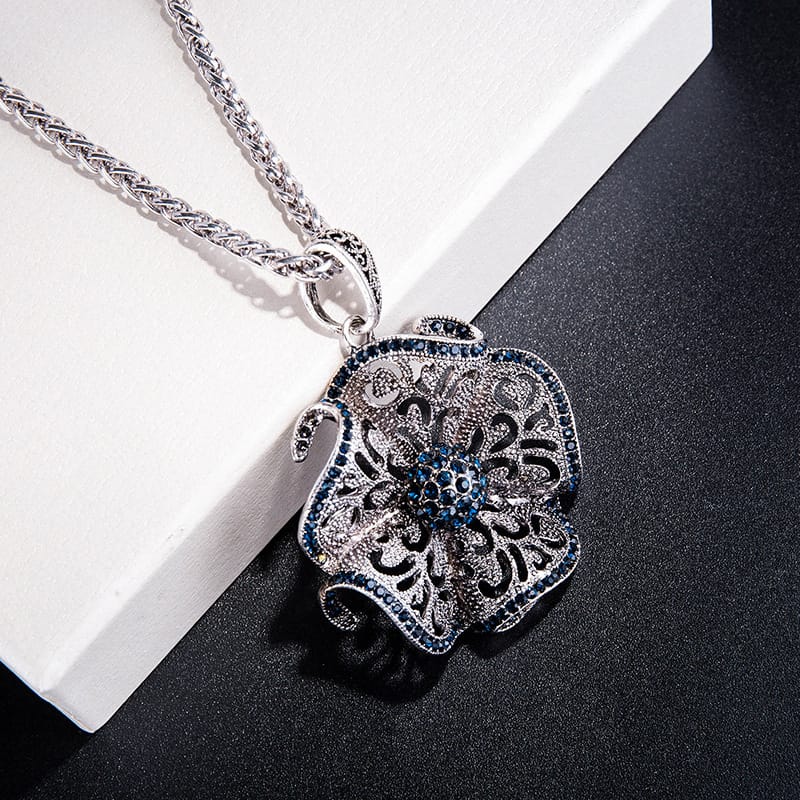 Filigree Mandala Pendant Necklace with Blue Rhinestone Accent and Elephant Motif Detail