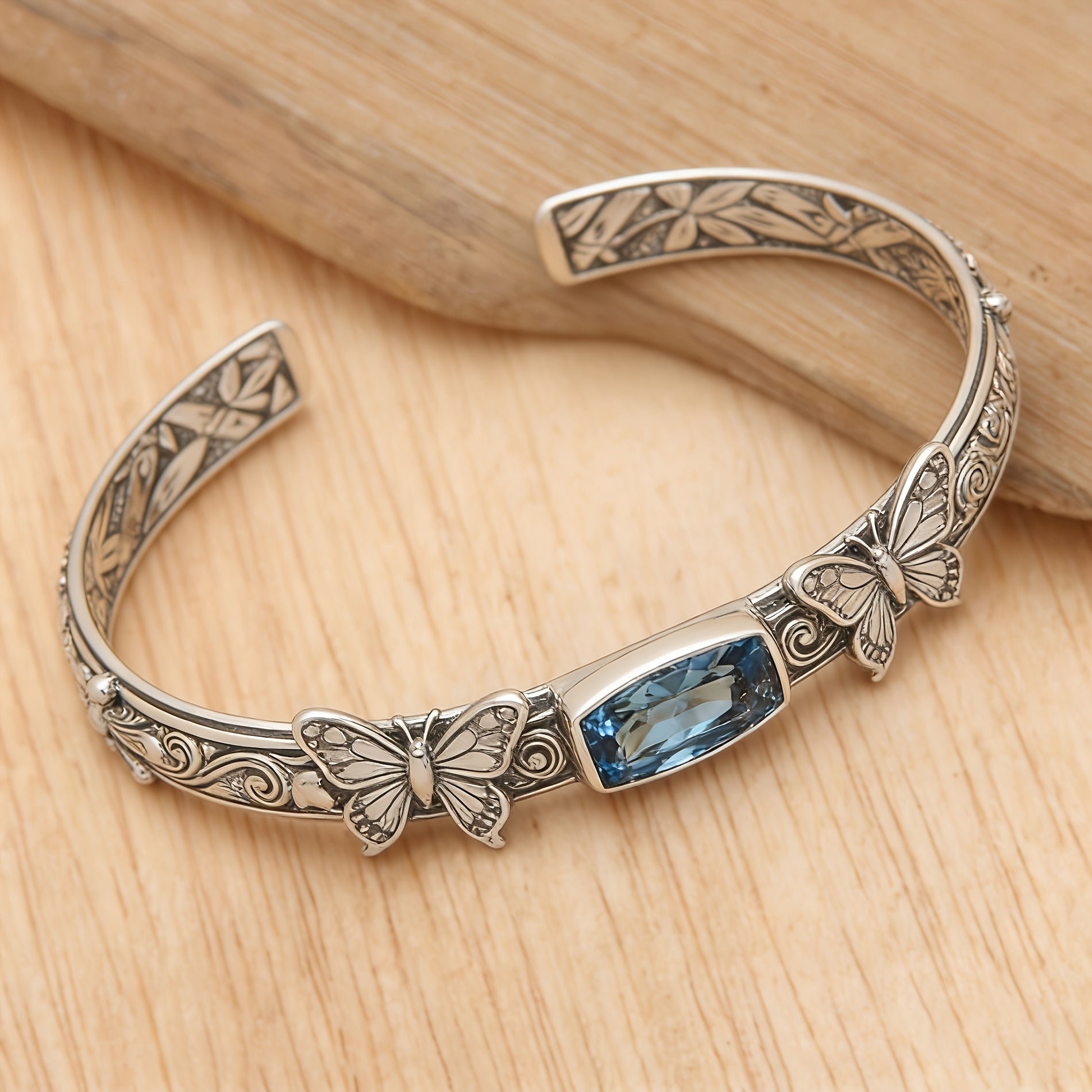 Butterfly Cuff Bracelet with Faceted Blue Stone Accent and Engraved Scrollwork