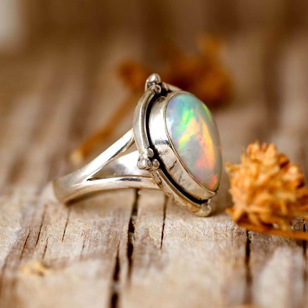 Teardrop Opal Ring with Silver Bezel Setting and Split Band