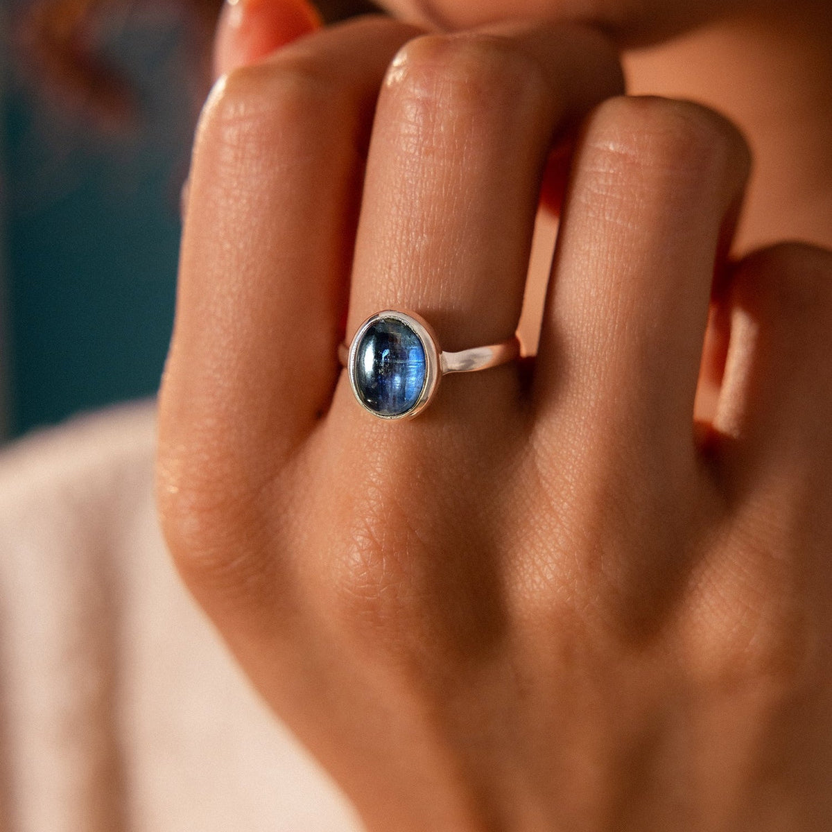 Oval Kyanite Cabochon Ring in Sterling Silver Bezel Setting