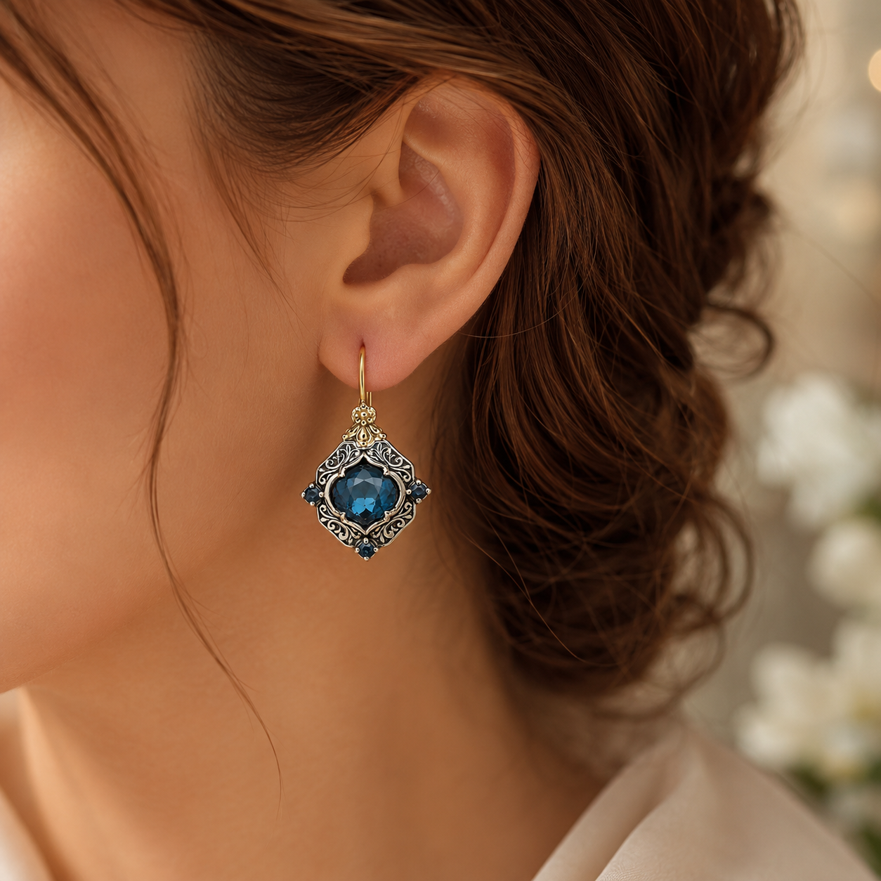 Blue Crystal Shield Drop Earrings with Two-Tone Scrollwork Frame