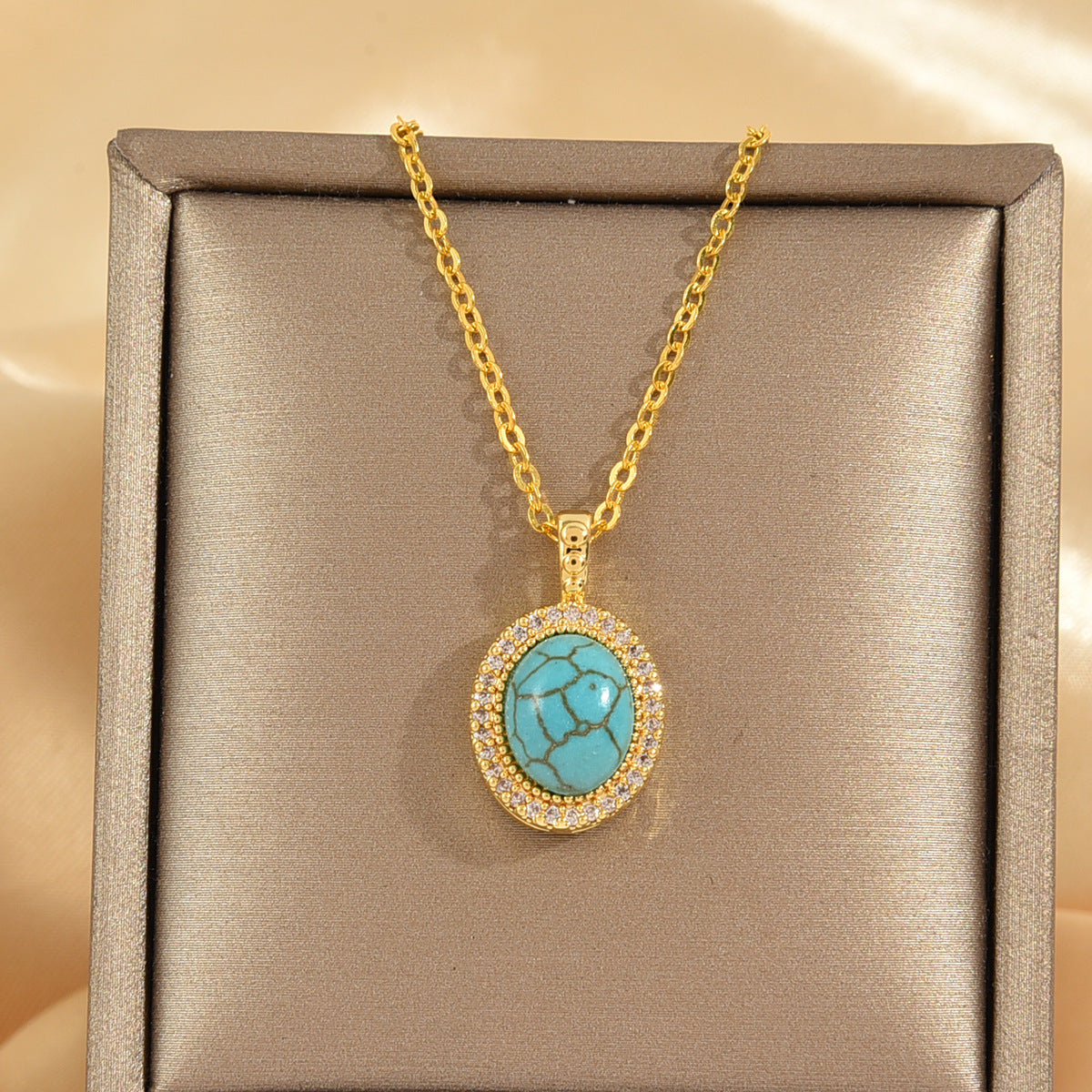 Oval Turquoise Pendant Necklace with Crystal Halo and Gold-Tone Chain