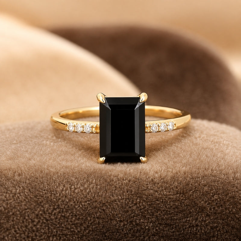 Rectangular Black Stone Ring with Gold-Tone Band and Accent Stones — main image