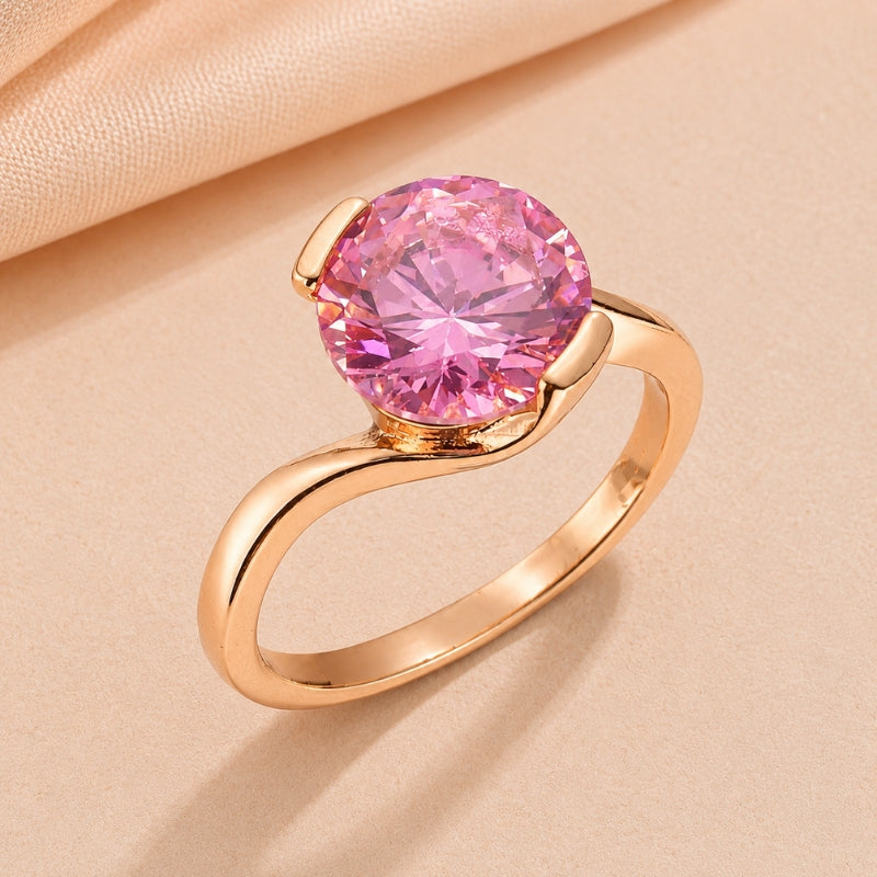 Round Pink Crystal Ring with Curved Rose Gold-Tone Band — main image