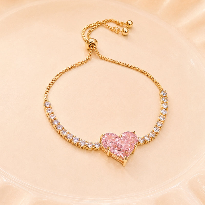 Heart-Shaped Pink Stone Charm Bracelet in Gold Tone with Clear Stone Accents — main image