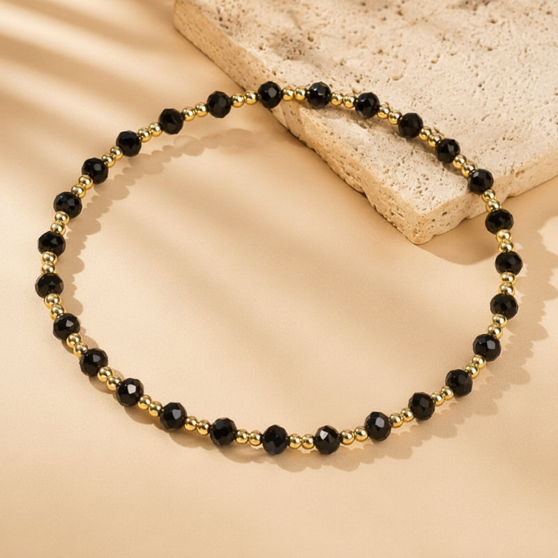 Black Faceted Bead Bracelet with Gold-Tone Spacers — main image
