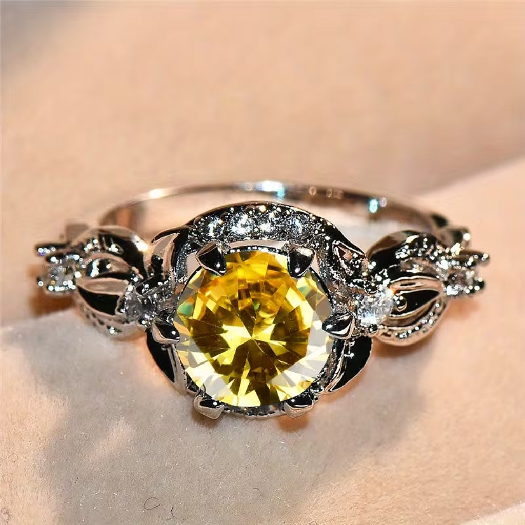 Vintage Floral Yellow Zircon Ring with Winged Side Details and Gold-Tone Band — main image