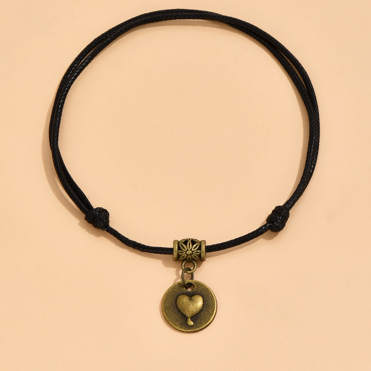 Heart Charm Anklet with Black Waxed Cord and Antique Brass Sun Bead Detail