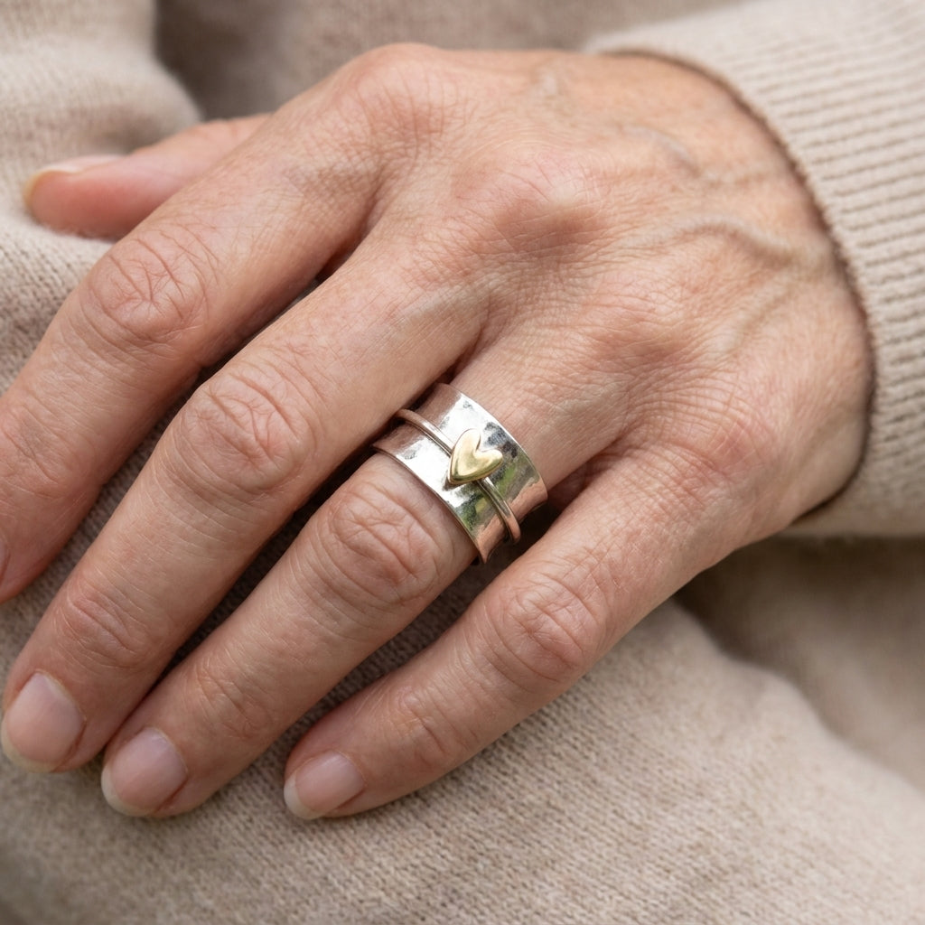 classic silver ring with golden heart accent — lifestyle