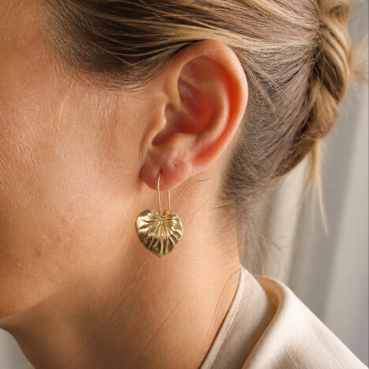 Heart-Shaped Gold-Tone Drop Earrings with Fluted Vein Detail — main image