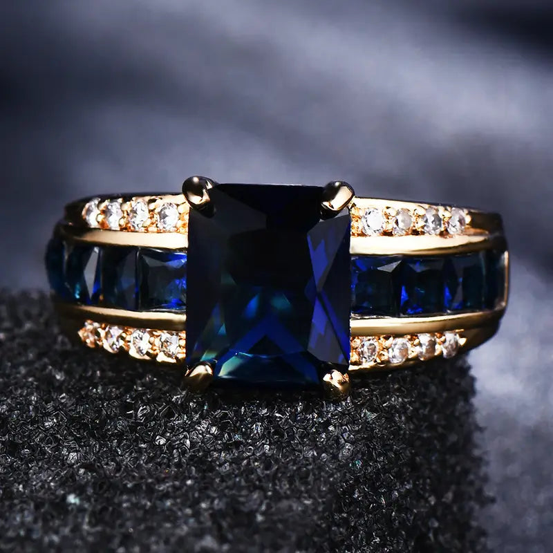 Cushion-Cut Blue Stone Cocktail Ring with Gold-Tone Band and Side Accent Stones — view 2