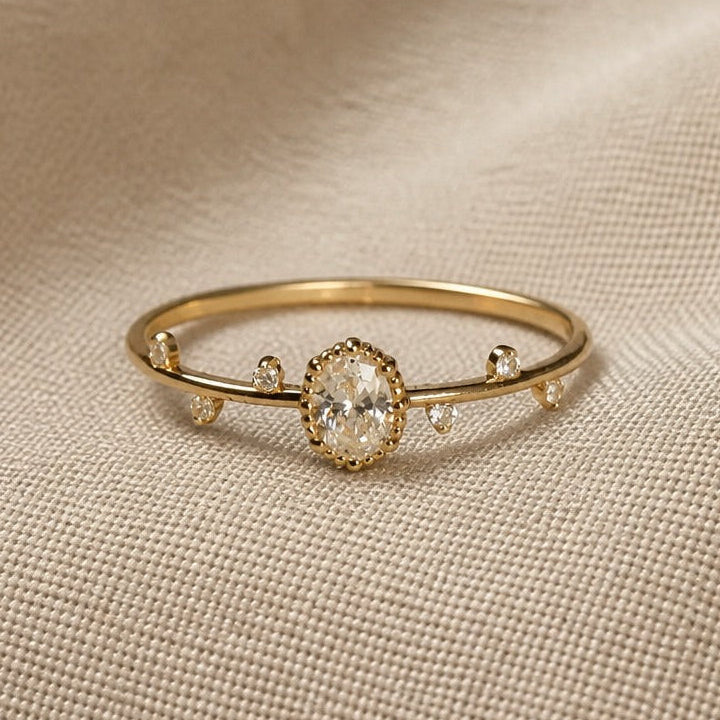Oval Cubic Zirconia Ring with Gold-Tone Open Band and Side Accents — main image
