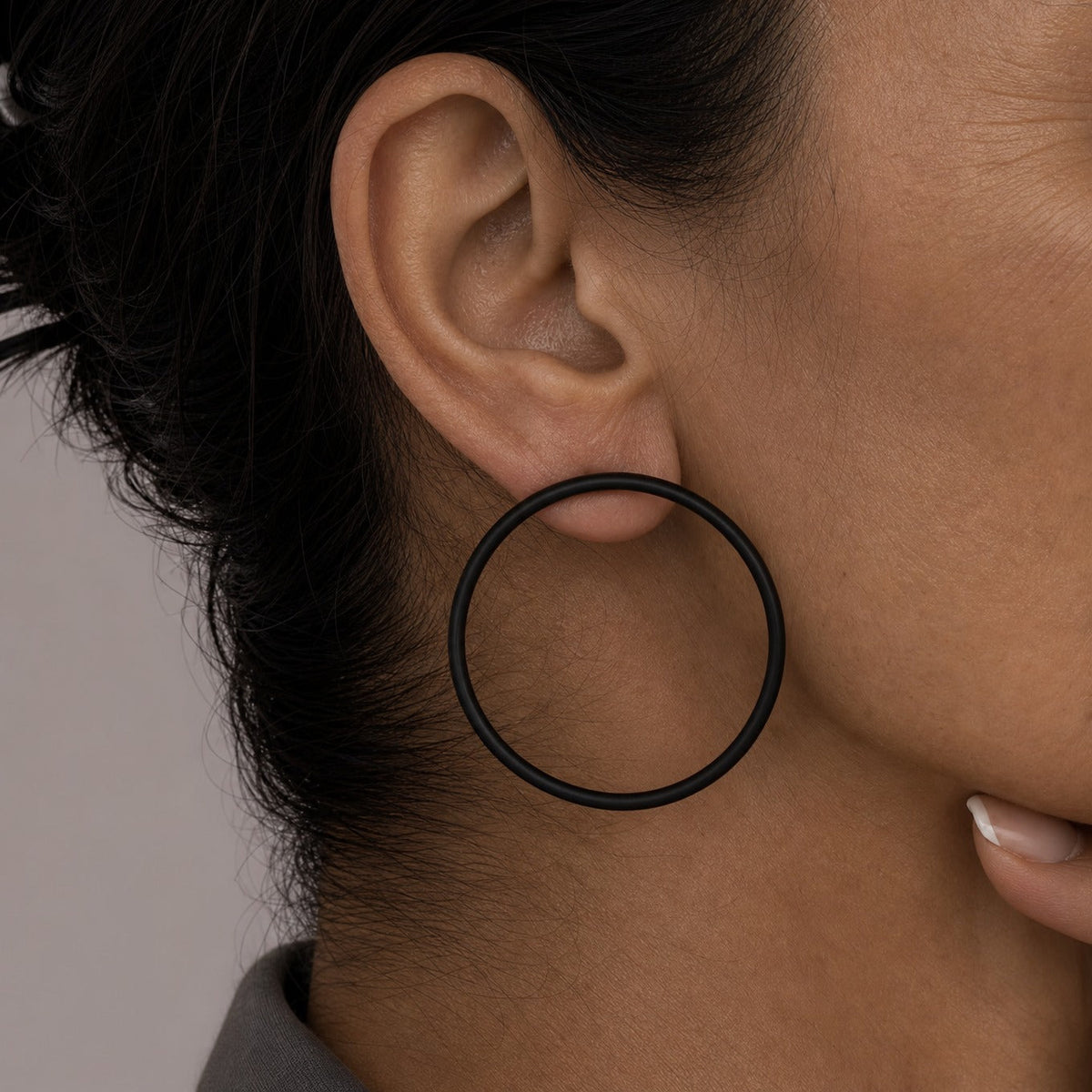 Black Hollow Circle Hoop Earrings with Gold-Plated Post — main image