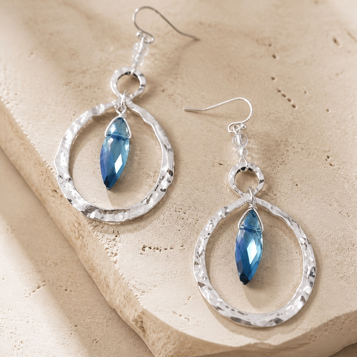 Faceted Blue Glass Drop Earrings with Hammered Teardrop Frame