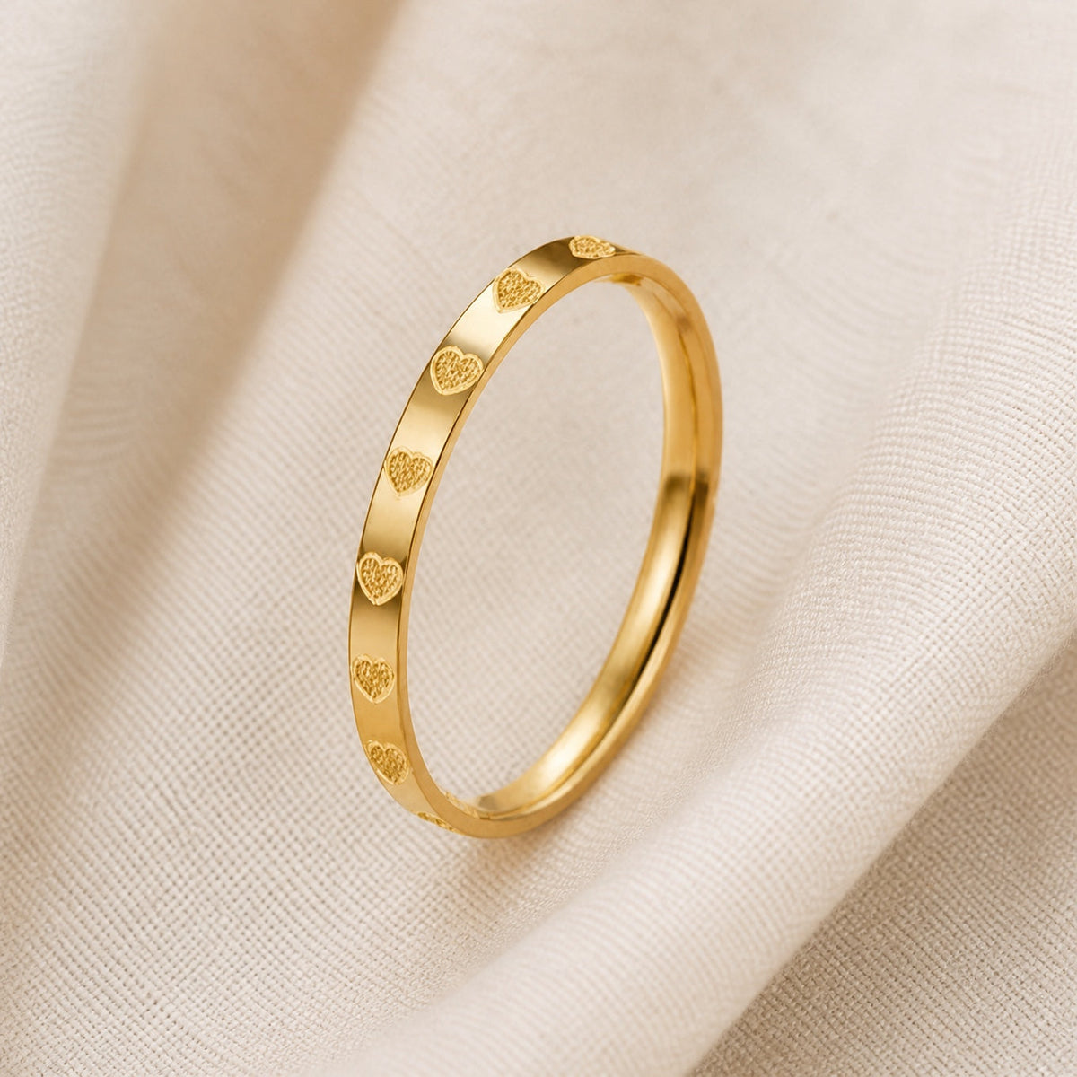 Heart Motif Gold-Tone Bangle Bracelet with Polished Finish — main image