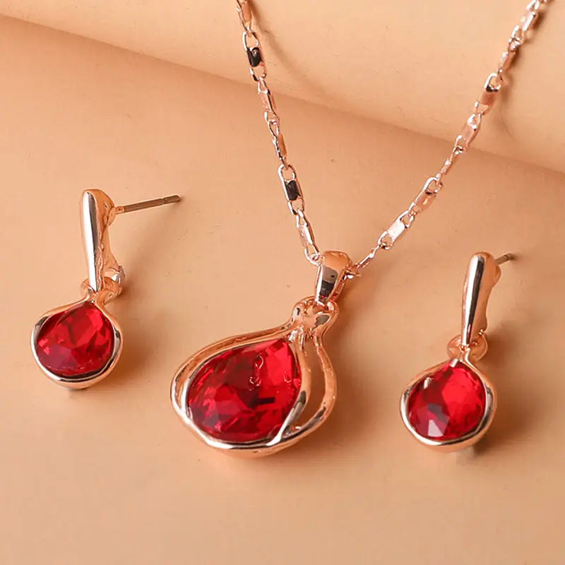 Teardrop Red Crystal Necklace & Earring Set in Rose Gold Tone with Bezel Setting — main image
