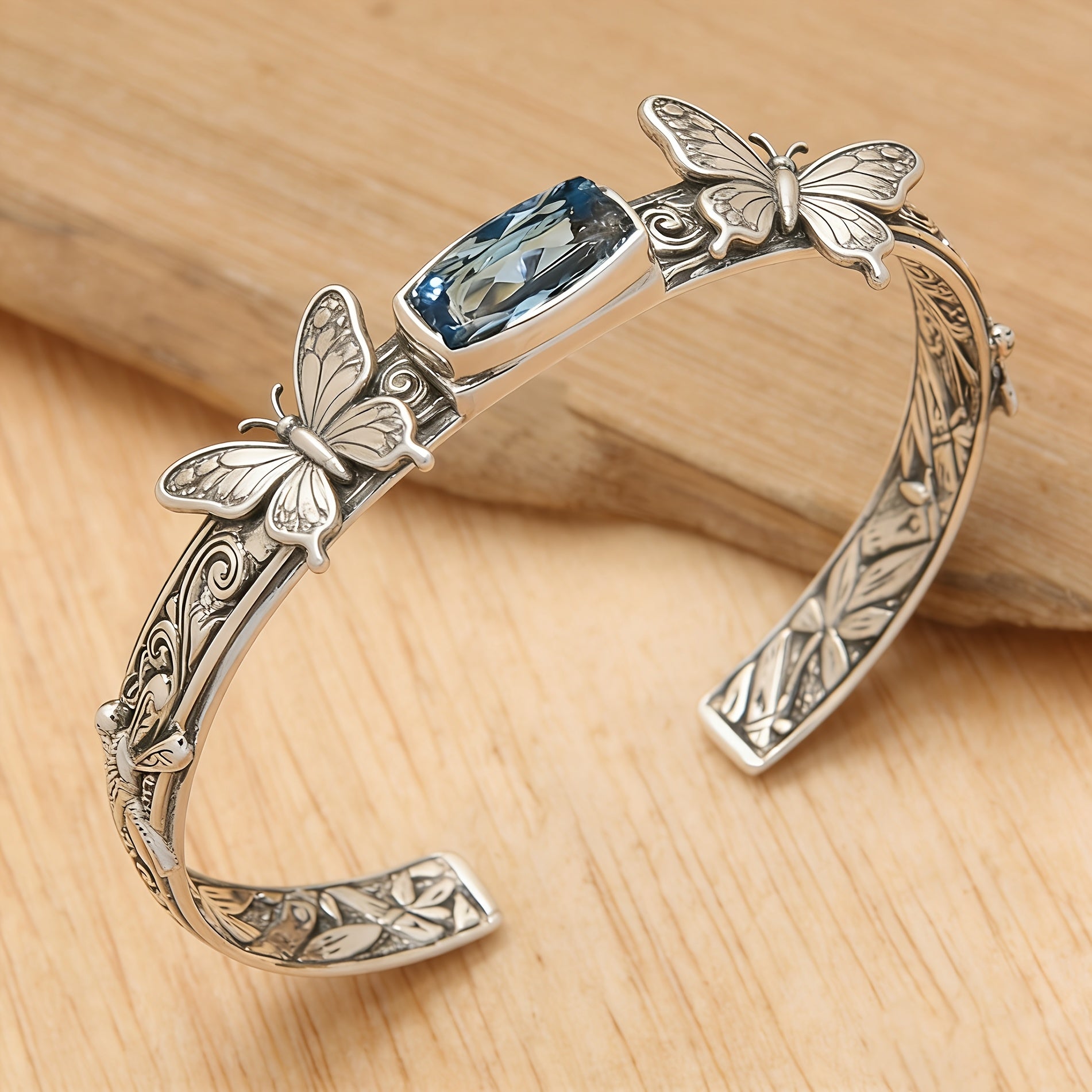 Butterfly Cuff Bracelet with Faceted Blue Stone Accent and Engraved Scrollwork