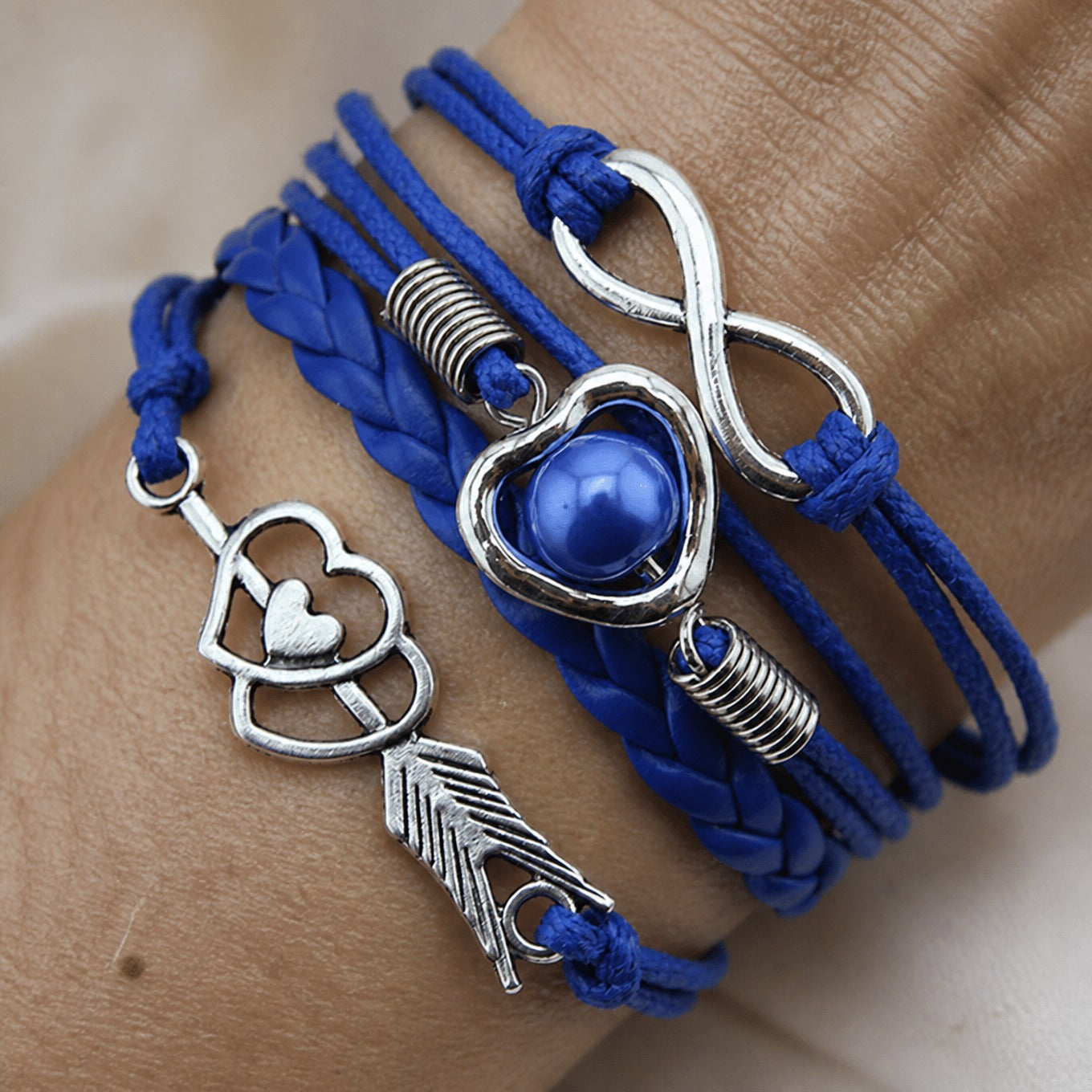 Braided Heart Charm Bracelet with Silver-Tone Feather and Infinity Details