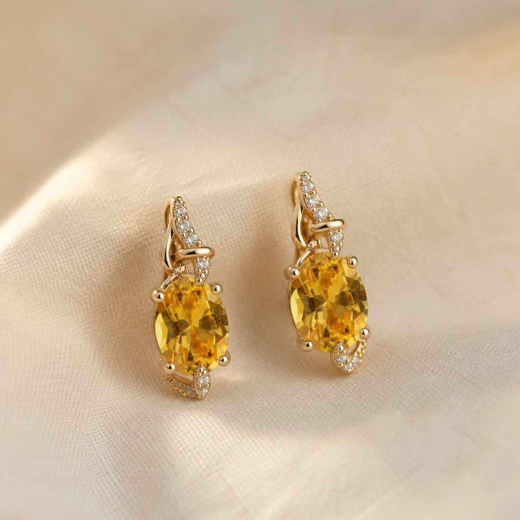 Oval Golden Zircon Drop Earrings with Accent Stones — main image