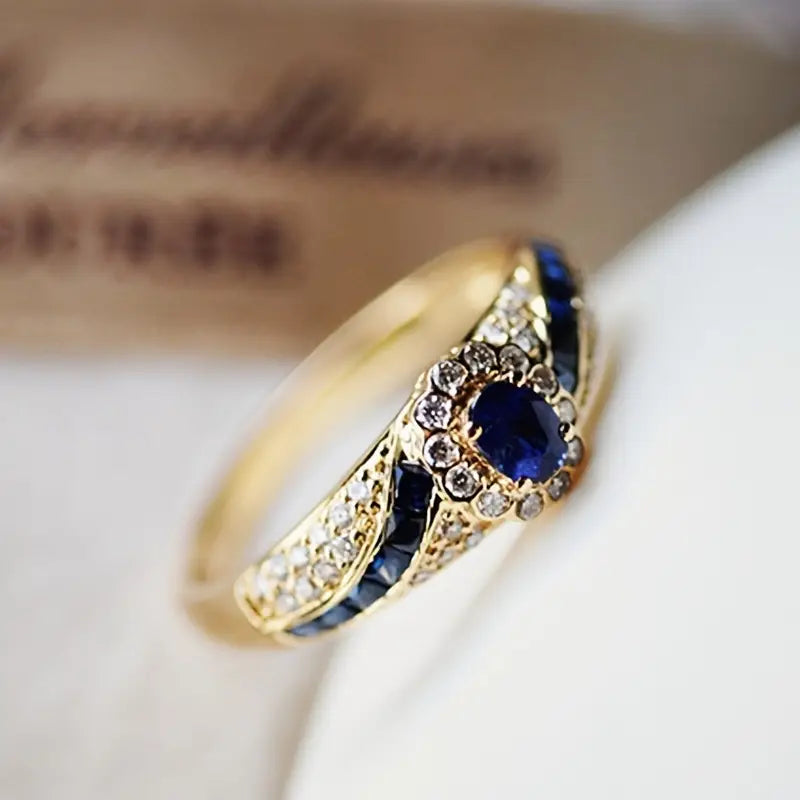 Oval Sapphire Halo Ring with Gold-Tone Filigree Band — main image
