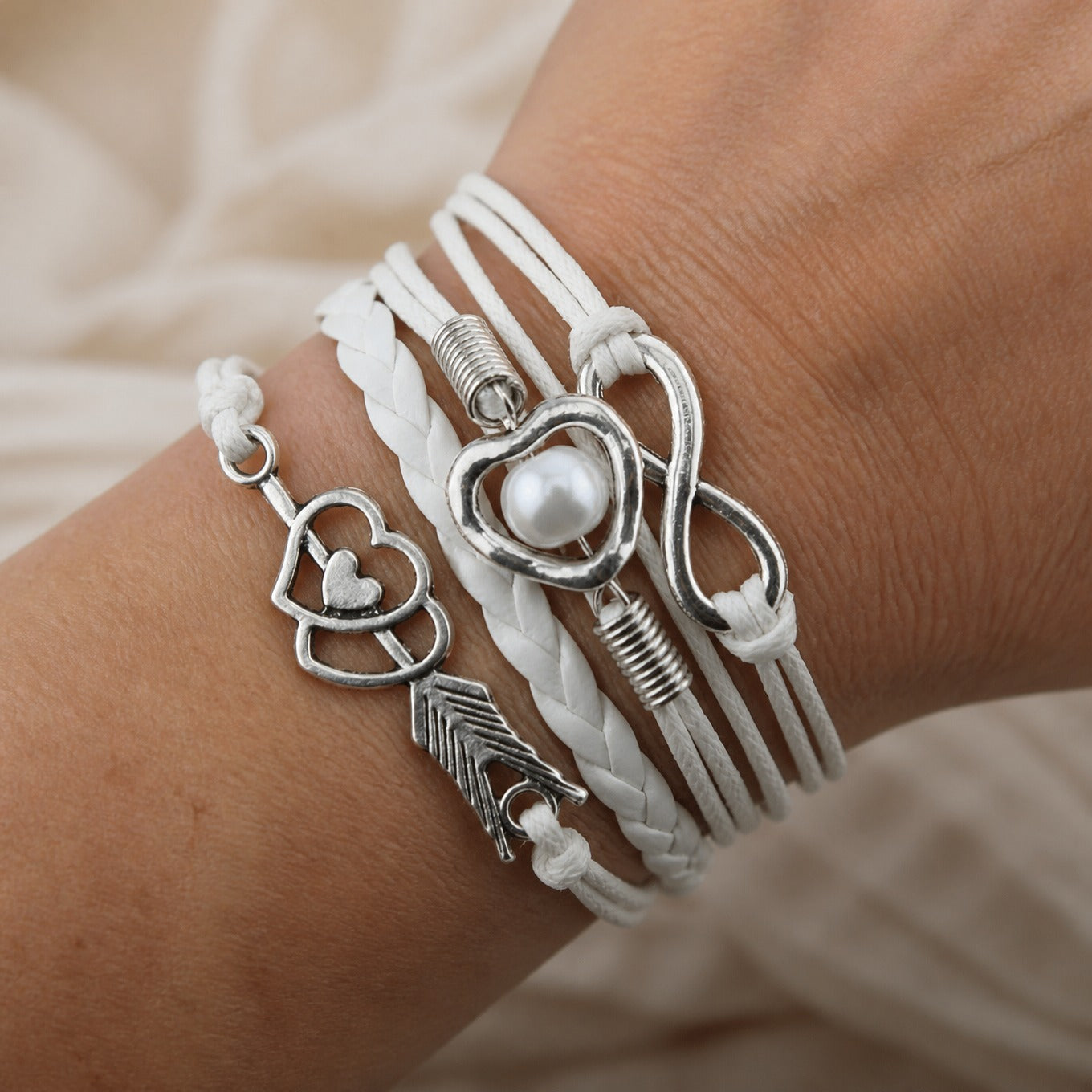Braided Heart Charm Bracelet with Silver-Tone Feather and Infinity Details
