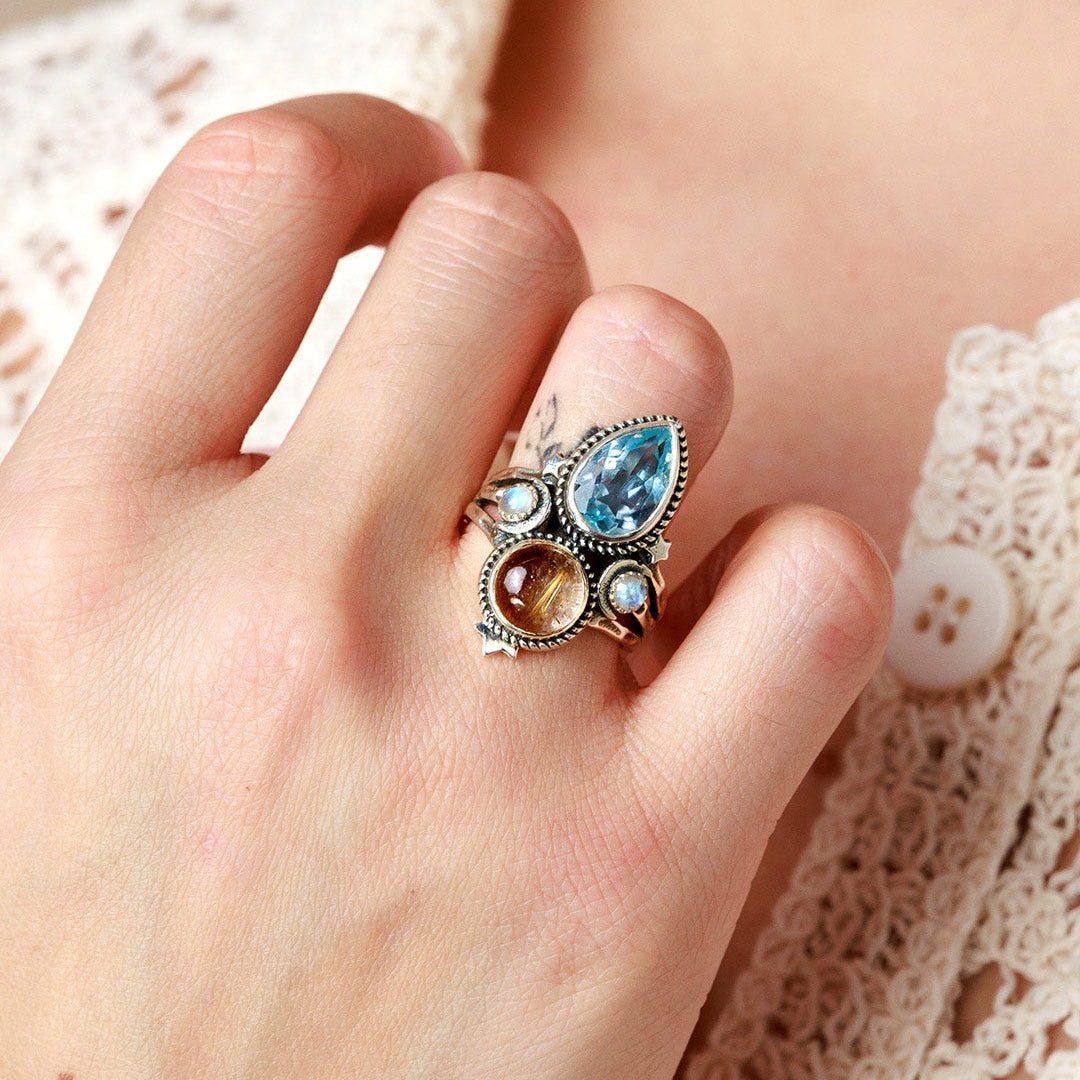 Celestial Crescent Moon Blue Topaz Ring with Rutilated Quartz Accents