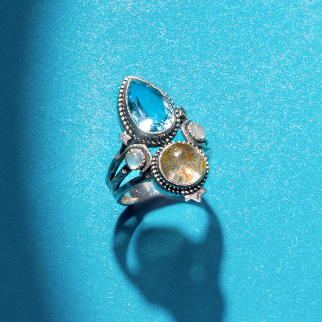Celestial Crescent Moon Blue Topaz Ring with Rutilated Quartz Accents