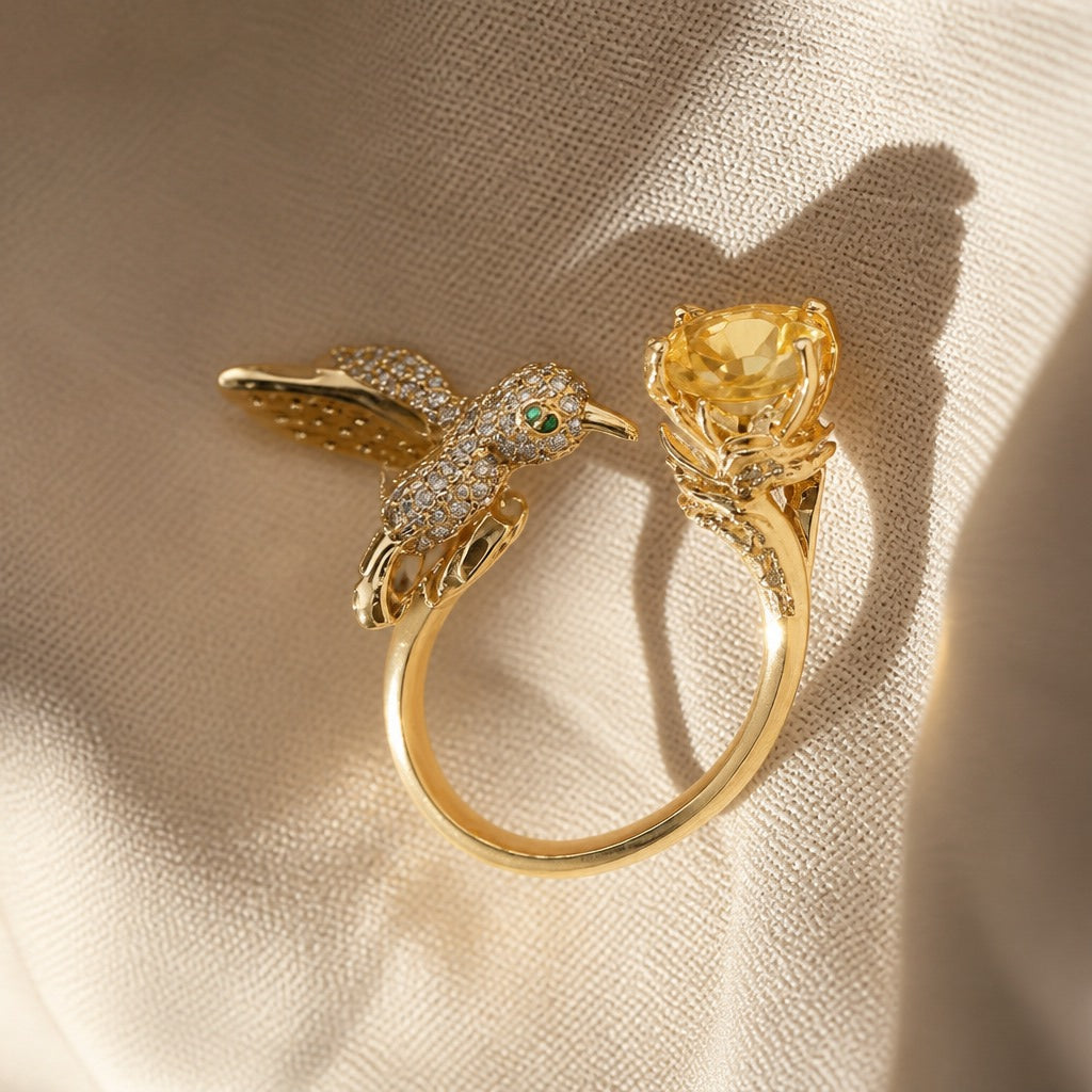 Crystal Hummingbird Ring with Green Eye Accent, Adjustable Gold-Tone Band — main image