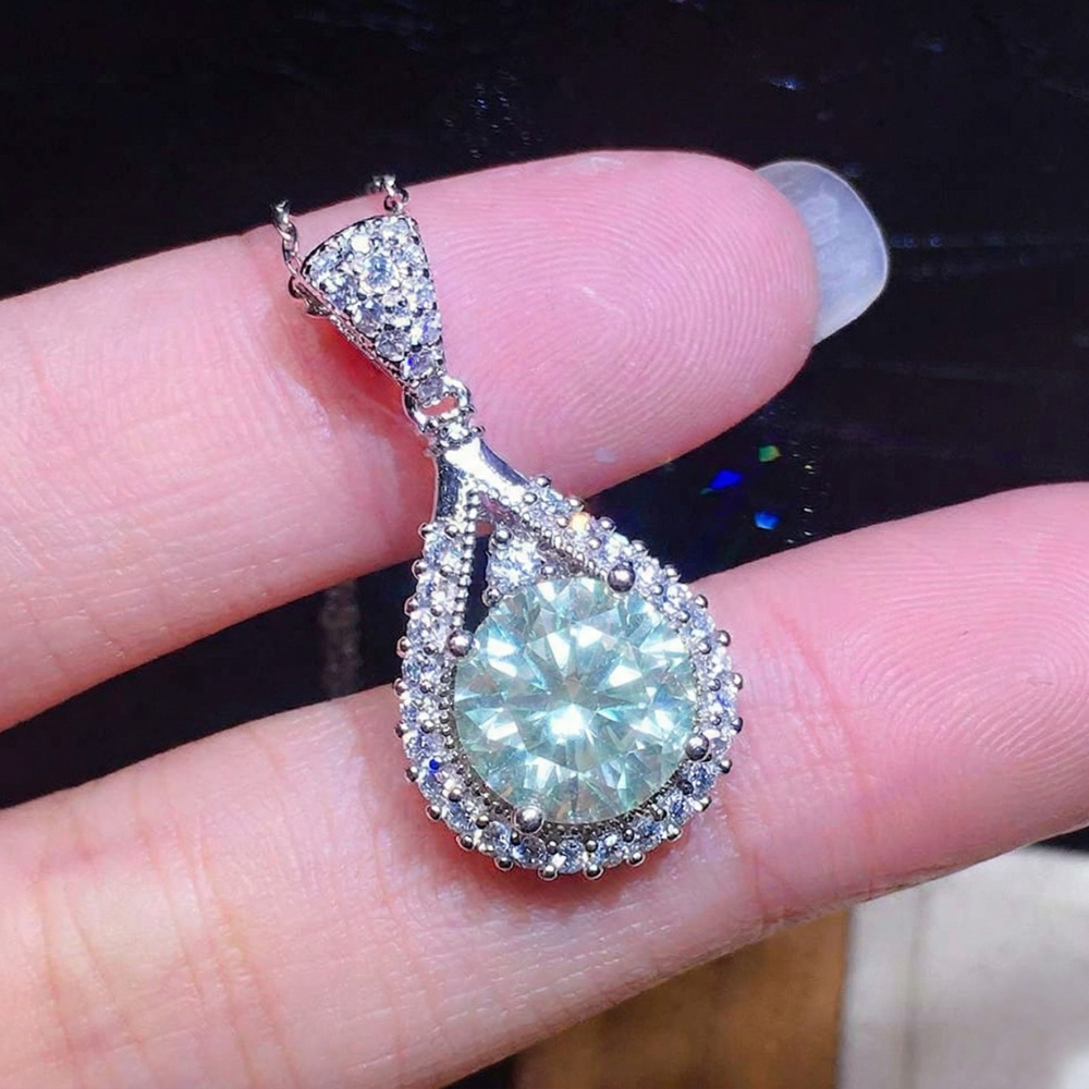 Pear-Shaped Emerald Halo Pendant Necklace in White Gold Tone