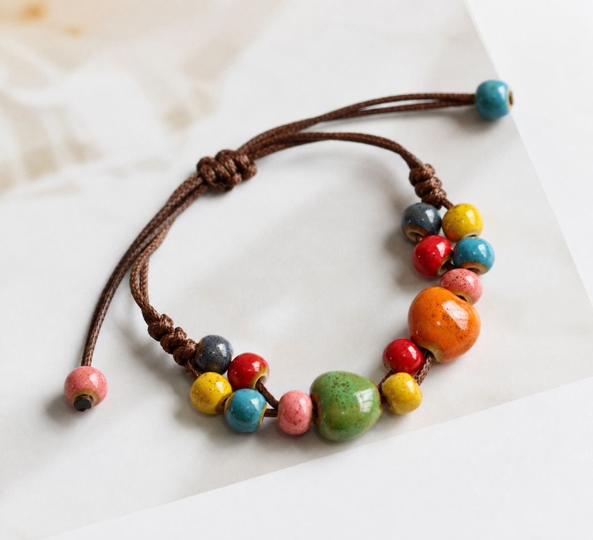 Multi-Color Ceramic Beaded Bracelet with Adjustable Woven Cord Closure — main image