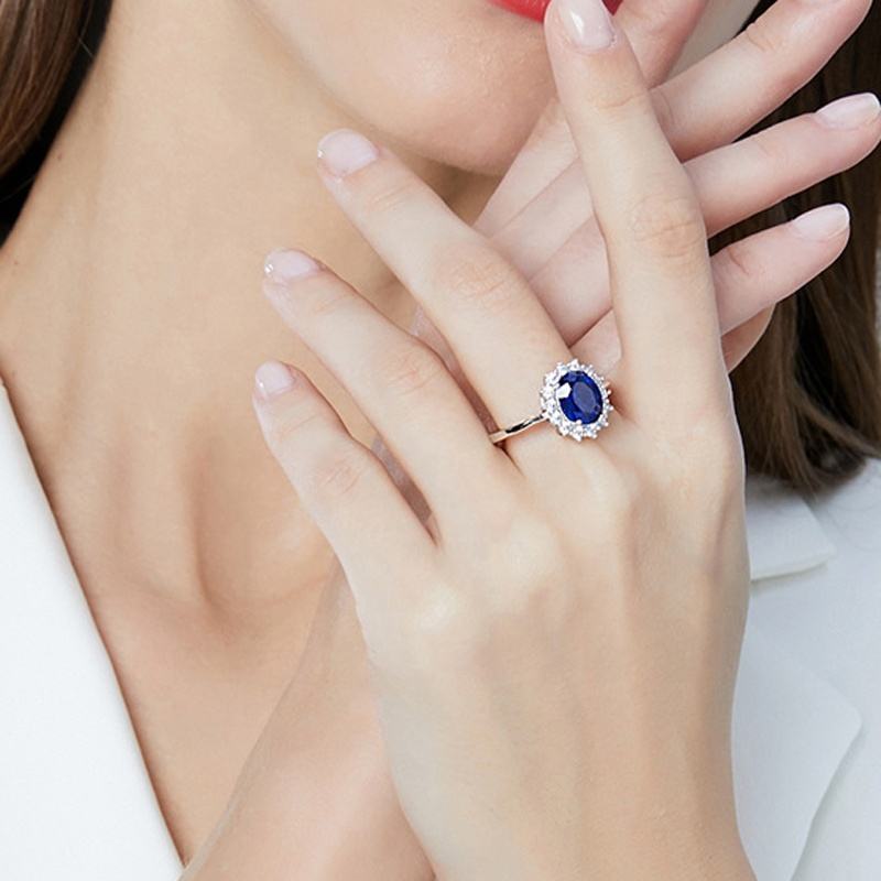 Oval Blue Sapphire Halo Ring with Two-Tone Band — view 4