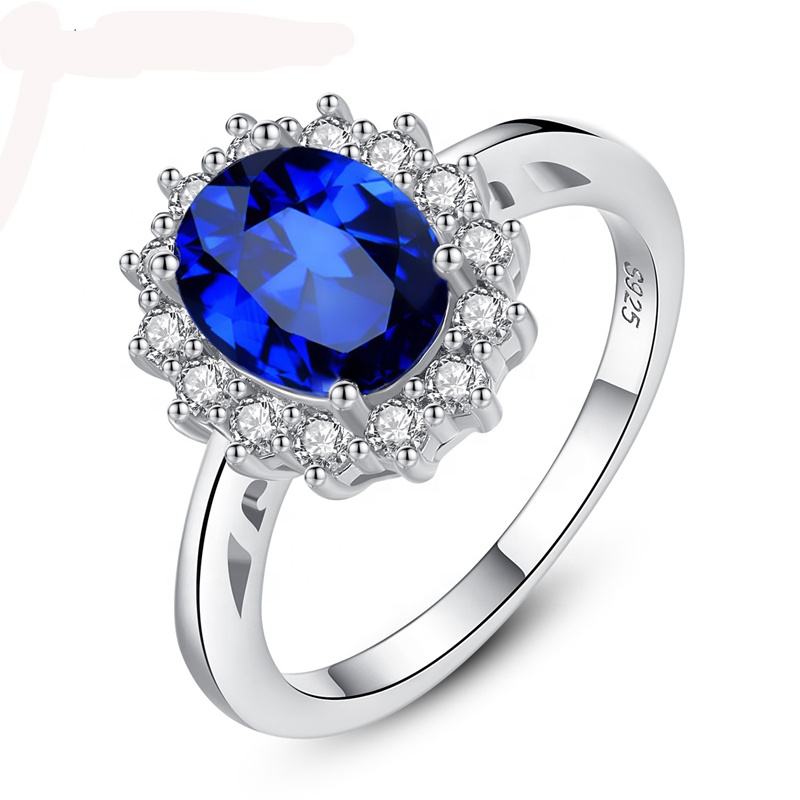 Oval Blue Sapphire Halo Ring with Two-Tone Band — main image