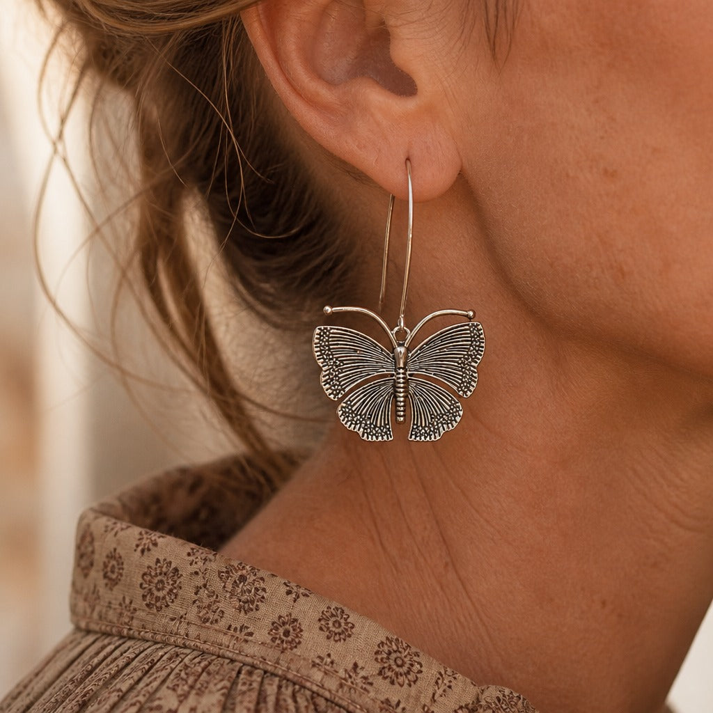 Carved Butterfly Drop Hoop Earrings in Silver Tone — main image