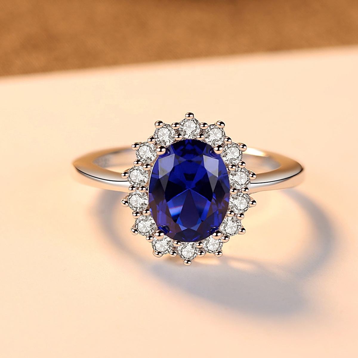 Oval Blue Sapphire Halo Ring with Two-Tone Band — view 2