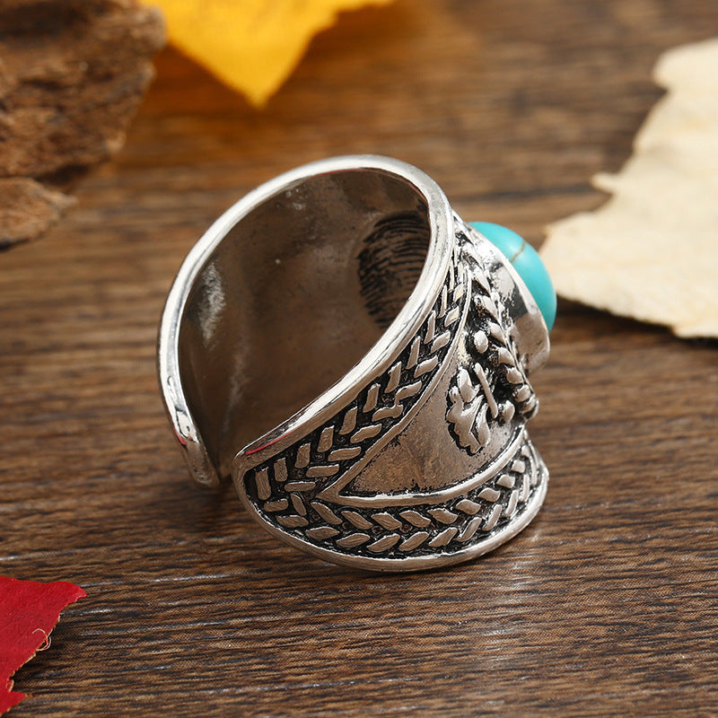 Round Turquoise Cabochon Ring with Open Braided Silver-Tone Band