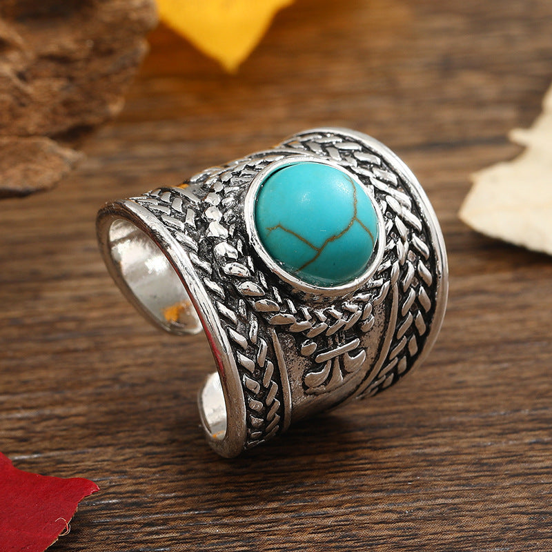 Round Turquoise Cabochon Ring with Open Braided Silver-Tone Band