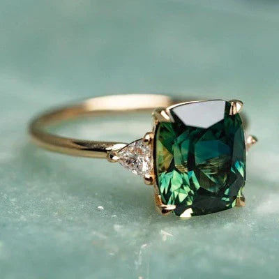 Cushion-Cut Green Gemstone Three-Stone Ring with Gold Tone Band