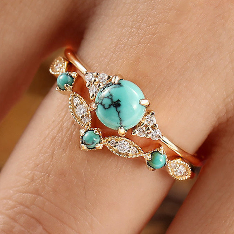 Turquoise Cabochon Ring Set with Scroll Detail in Gold Tone