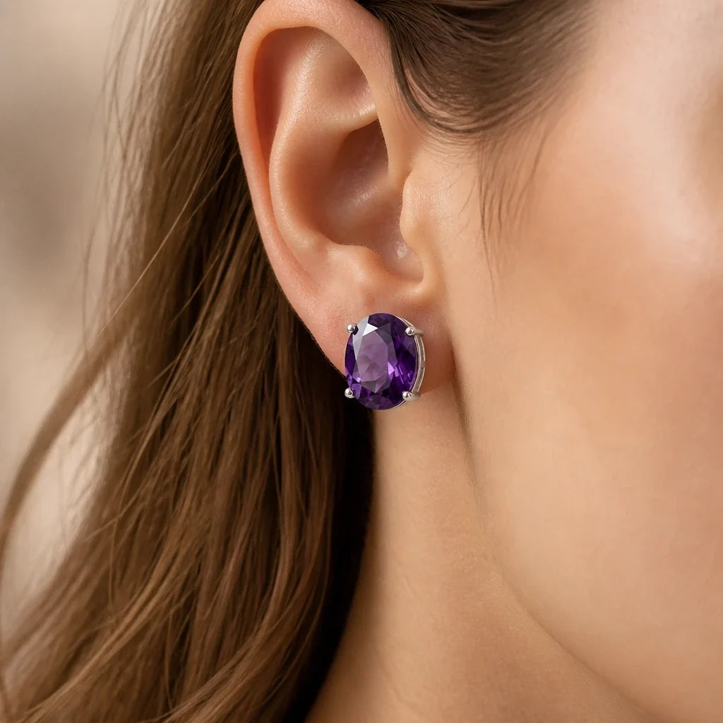 Oval Faceted Amethyst Stud Earrings with Silver-Toned Prong Setting