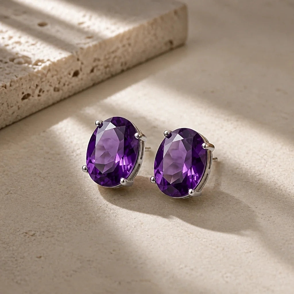 Oval Faceted Amethyst Stud Earrings with Silver-Toned Prong Setting