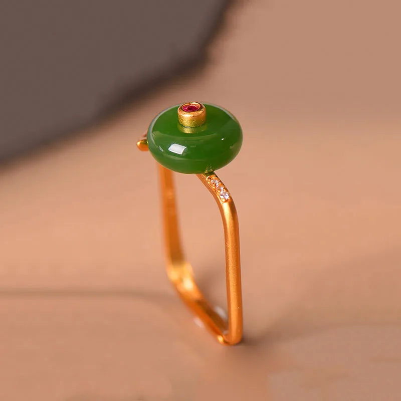 Domed Jade Cabochon Ring with Pink Accent Stone and Gold-Tone Band — main image