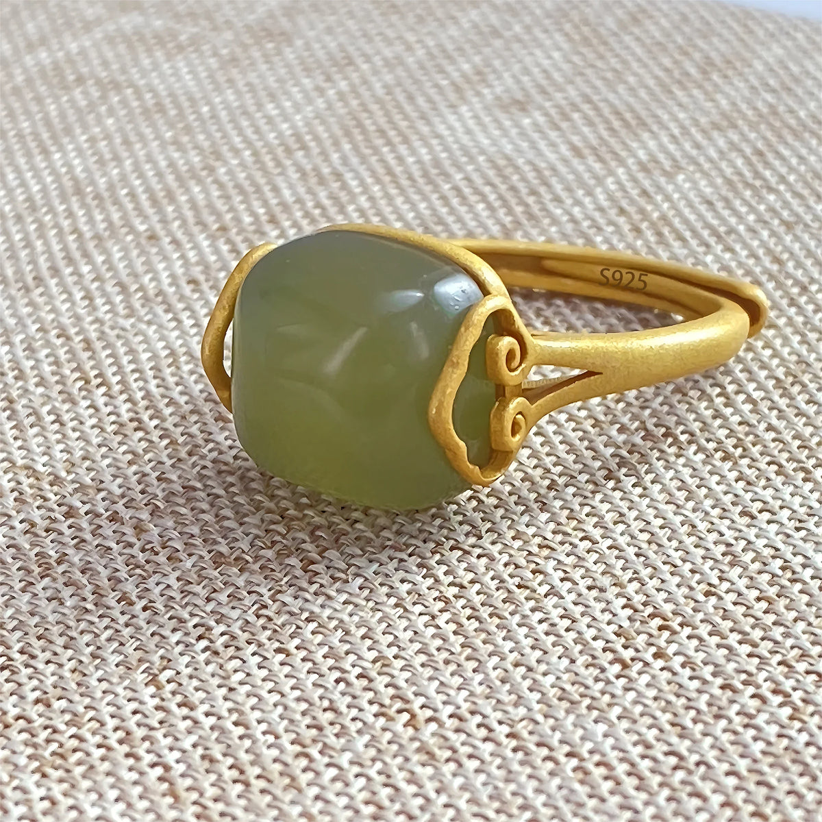 Oval Green Jade Cabochon Ring with Scroll Detail, Adjustable Sterling Silver Band — main image