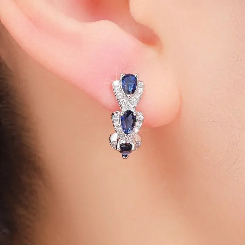Pear-Shaped Sapphire Hoop Earrings with Tiered Halo Design — main image