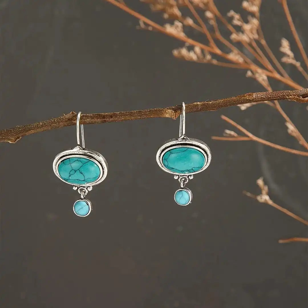 Oval Turquoise Drop Earrings with Silver Bloom Detail and Round Stone Accent — view 3
